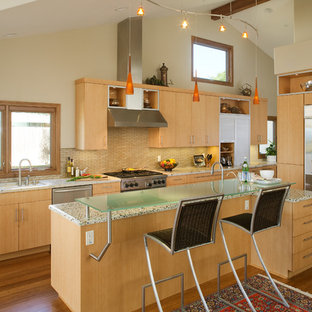 Design ideas for a large contemporary single-wall eat-in kitchen in San Diego with an undermount sink, flat-panel cabinets, light wood cabinets, recycled glass benchtops, porcelain splashback, stainless steel appliances, medium hardwood floors, with island and beige splashback.