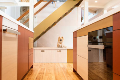 Inspiration for a large contemporary galley light wood floor eat-in kitchen remodel in Los Angeles with an undermount sink, flat-panel cabinets, quartz countertops, paneled appliances, no island, white countertops and red cabinets