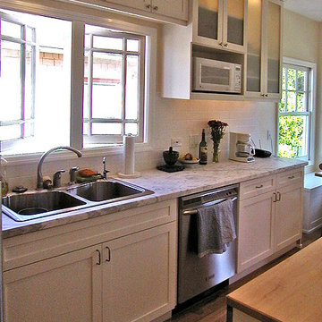 Marble counters, painted maple cabinets.