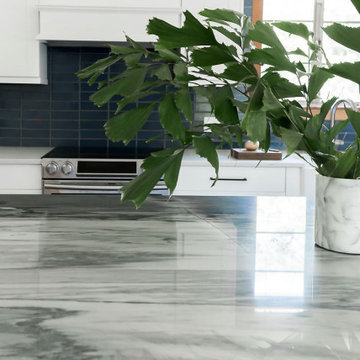 Marble Kitchen Island and Navy Blue Thin Brick Backsplash