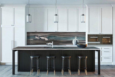 Inspiration for a contemporary gray floor kitchen remodel in New York with an undermount sink, an island and multicolored countertops