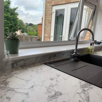 Marble look worktop and upstand with Silgranit sink