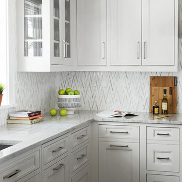 Marble Mosaic Backsplash with White Macauba Countertops