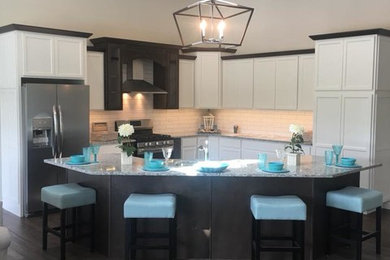 Inspiration for a mid-sized transitional l-shaped dark wood floor and brown floor open concept kitchen remodel in Chicago with shaker cabinets, white cabinets, an island, white backsplash, subway tile backsplash, stainless steel appliances, gray countertops and a double-bowl sink