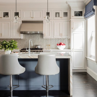 Large transitional l-shaped eat-in kitchen in Boston with an undermount sink, beaded inset cabinets, beige cabinets, marble benchtops, grey splashback, glass tile splashback, stainless steel appliances, dark hardwood floors, with island, brown floor and white benchtop.