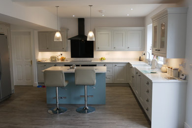This is an example of a medium sized classic kitchen in Hampshire.
