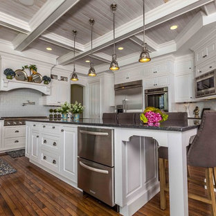 Kitchen - traditional kitchen idea in Seattle with stainless steel appliances and subway tile backsplash
