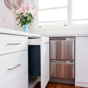 White shaker profile kitchen with pull-out bins