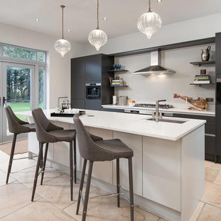 This is an example of a contemporary kitchen in Other with an integrated sink, flat-panel cabinets, solid surface benchtops, stainless steel appliances, with island and yellow benchtop.