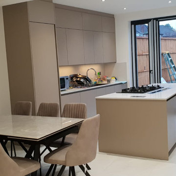 Matt Stone Grey Handleless kitchen in an open plan design in north London N12