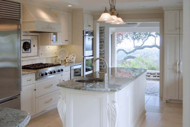 Mid-sized transitional single-wall ceramic tile eat-in kitchen photo in San Francisco with a single-bowl sink, raised-panel cabinets, white cabinets, marble countertops, stainless steel appliances and an island