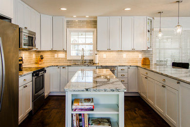 Inspiration for a mid-sized u-shaped dark wood floor kitchen remodel in DC Metro with an undermount sink, flat-panel cabinets, white cabinets, quartz countertops, gray backsplash, glass tile backsplash, stainless steel appliances and an island