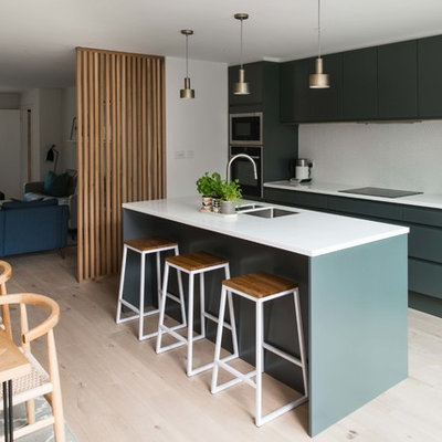 Eat-in kitchen - modern single-wall light wood floor eat-in kitchen idea in London with a drop-in sink, flat-panel cabinets, gray cabinets, quartzite countertops, an island and white countertops