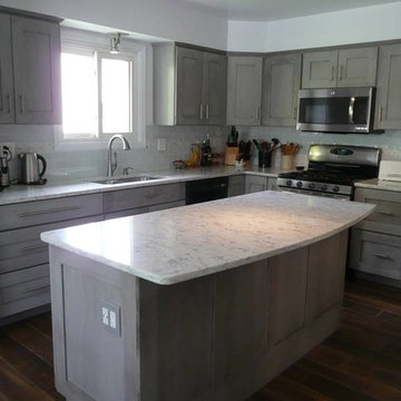 Medallion Cherry Peppercorn Cabinets with Rococo Quartz countertops