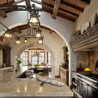 Mediterranean kitchen in San Francisco with black appliances.