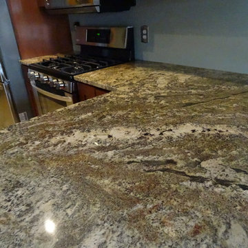 Medium Alder Shaker Cabinetry & Netuno Bordeaux Granite Countertops