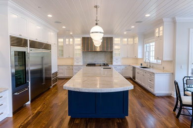 Inspiration for a huge transitional u-shaped kitchen remodel in Los Angeles with recessed-panel cabinets