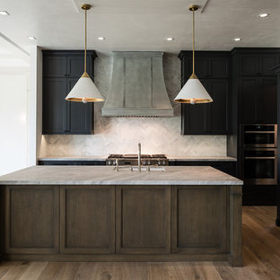 Design ideas for a large transitional l-shaped open plan kitchen in Miami with beige cabinets, marble benchtops, beige splashback, stainless steel appliances, medium hardwood floors, with island, an undermount sink, louvered cabinets and terra-cotta splashback.