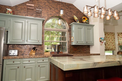 Kitchen pantry - large traditional u-shaped porcelain tile and beige floor kitchen pantry idea in Houston with an island, a farmhouse sink, beaded inset cabinets, green cabinets, quartzite countertops, brown backsplash, metal backsplash, stainless steel appliances and green countertops