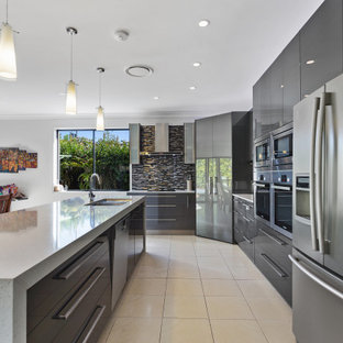 Design ideas for a modern kitchen in Gold Coast - Tweed with a double-bowl sink, grey cabinets, multi-coloured splashback, ceramic splashback, stainless steel appliances, with island, white benchtop, porcelain floors and yellow floor.