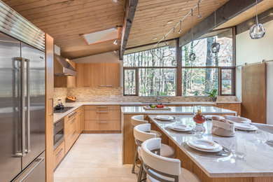 Open concept kitchen - large contemporary l-shaped ceramic tile and white floor open concept kitchen idea in Boston with an undermount sink, flat-panel cabinets, light wood cabinets, granite countertops, beige backsplash, brick backsplash, stainless steel appliances and an island