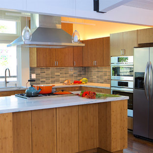 Inspiration for a mid-sized midcentury l-shaped open plan kitchen in San Francisco with an undermount sink, flat-panel cabinets, medium wood cabinets, quartzite benchtops, ceramic splashback, stainless steel appliances, medium hardwood floors, a peninsula, blue splashback, white benchtop and exposed beam.