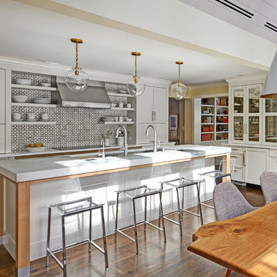 Eat-in kitchen - large transitional galley dark wood floor and brown floor eat-in kitchen idea in Chicago with an undermount sink, shaker cabinets, white cabinets, marble countertops, porcelain backsplash, paneled appliances, an island and multicolored backsplash