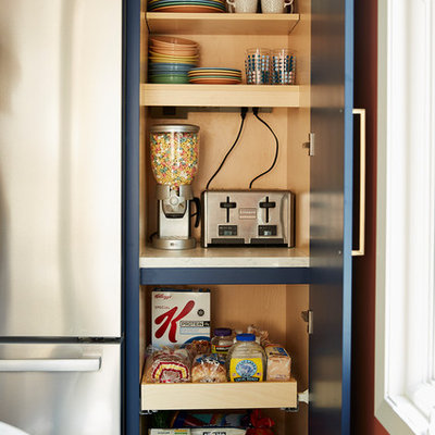 Enclosed kitchen - mid-sized mid-century modern u-shaped cement tile floor and gray floor enclosed kitchen idea in Minneapolis with an undermount sink, flat-panel cabinets, quartz countertops, white backsplash, cement tile backsplash, stainless steel appliances, no island, black countertops and blue cabinets