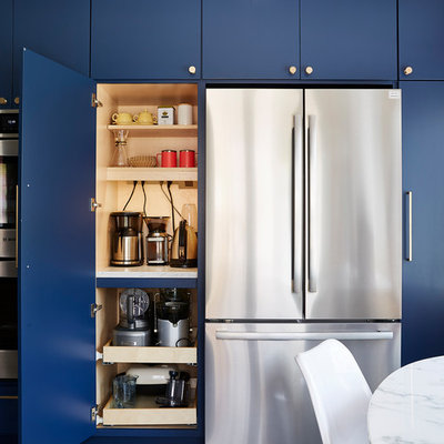 Example of a mid-sized 1960s u-shaped cement tile floor and gray floor enclosed kitchen design in Minneapolis with an undermount sink, flat-panel cabinets, blue cabinets, quartz countertops, white backsplash, cement tile backsplash, stainless steel appliances, no island and black countertops