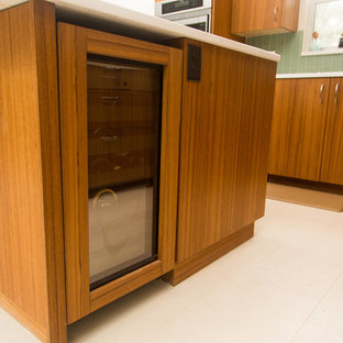 Inspiration for a midcentury l-shaped kitchen in Other with flat-panel cabinets, medium wood cabinets and with island.