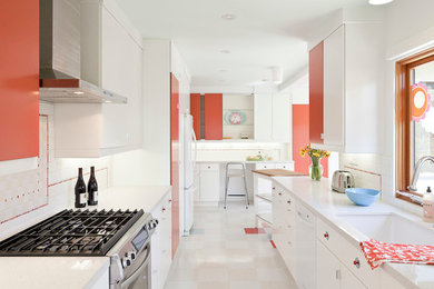 Eat-in kitchen - small l-shaped linoleum floor eat-in kitchen idea in Portland with an undermount sink, flat-panel cabinets, white cabinets, quartz countertops, white backsplash, subway tile backsplash, white appliances and a peninsula