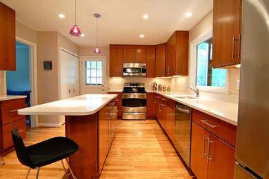Example of a large 1960s l-shaped light wood floor open concept kitchen design in DC Metro with an undermount sink, flat-panel cabinets, light wood cabinets, quartz countertops, beige backsplash and an island