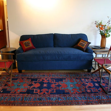 Midcentury Modern Setting Highlights Antique tribal and village carpets