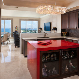 Design ideas for a mid-sized contemporary u-shaped eat-in kitchen in Miami with raised-panel cabinets, dark wood cabinets, brown splashback, stainless steel appliances, an undermount sink, quartz benchtops, marble floors, with island, beige floor and red benchtop.