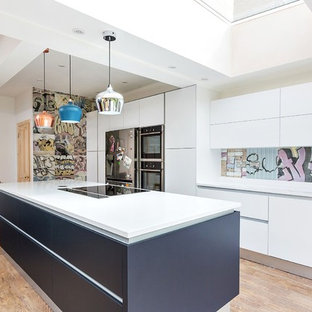 Design ideas for a contemporary single-wall kitchen in Other with flat-panel cabinets, white cabinets, light hardwood flooring and an island.
