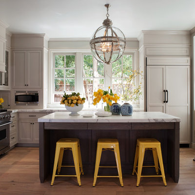 Kitchen - traditional l-shaped kitchen idea in San Francisco with subway tile backsplash, recessed-panel cabinets, gray cabinets, marble countertops, white backsplash and paneled appliances