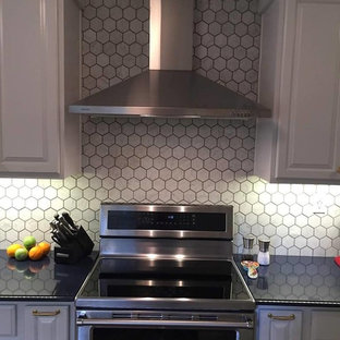 This is an example of a small eclectic galley separate kitchen in Other with an undermount sink, raised-panel cabinets, white cabinets, quartz benchtops, white splashback, marble splashback, stainless steel appliances, porcelain floors, no island, brown floor and blue benchtop.