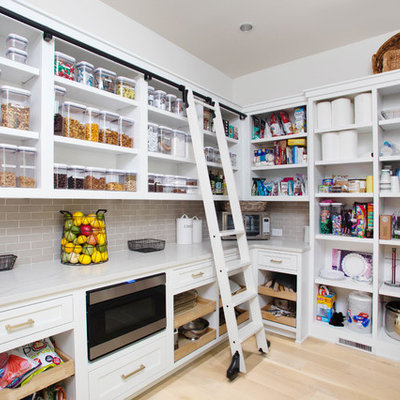 Transitional u-shaped light wood floor and beige floor kitchen pantry photo in Atlanta with open cabinets, white cabinets, gray backsplash, subway tile backsplash, no island and white countertops