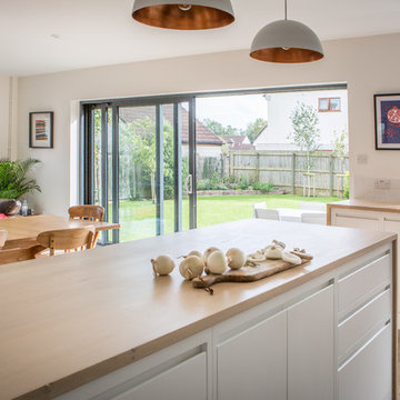 Minimalist White Kitchen with Warm Accents