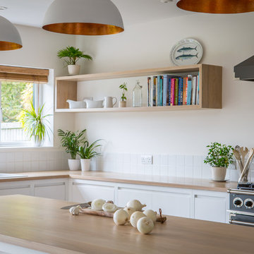 Minimalist White Kitchen with Warm Accents
