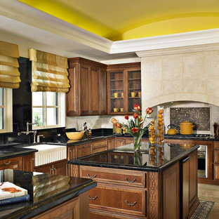 Ispirazione per una cucina mediterranea con lavello stile country, ante di vetro, ante in legno bruno, paraspruzzi multicolore, paraspruzzi con piastrelle a mosaico, elettrodomestici in acciaio inossidabile e 2 o più isole