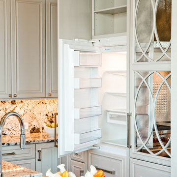 Mirrored Kitchen Cabinetry with Built In Refrigerators