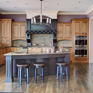 Large traditional open concept kitchen appliance - Inspiration for a large timeless u-shaped dark wood floor and brown floor open concept kitchen remodel in Chicago with an undermount sink, raised-panel cabinets, medium tone wood cabinets, gray backsplash, stainless steel appliances, an island, beige countertops, granite countertops and porcelain backsplash