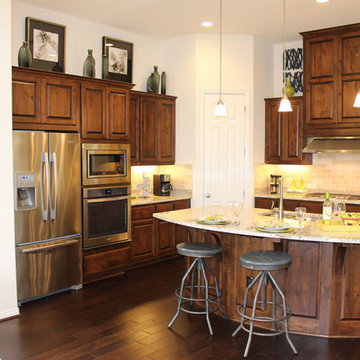 Model home kitchen with knotty alder cabinets