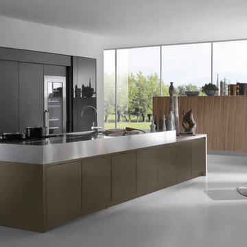 Modern black and wood kitchen with hidden appliances and stainelss counter