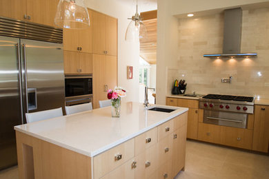 Mid-sized minimalist u-shaped porcelain tile and beige floor open concept kitchen photo in San Francisco with an undermount sink, flat-panel cabinets, light wood cabinets, quartzite countertops, beige backsplash, wood backsplash, stainless steel appliances and an island