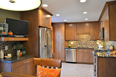 Enclosed kitchen - mid-sized contemporary l-shaped ceramic tile enclosed kitchen idea in DC Metro with an undermount sink, flat-panel cabinets, medium tone wood cabinets, brown backsplash, granite countertops, glass tile backsplash and stainless steel appliances