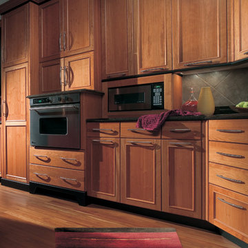 Modern Cherry Wood Kitchen design with Stainless Steel Appliances and Accents