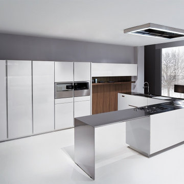 Modern, clean-lines from a completely handle-less white lacquered kitchen