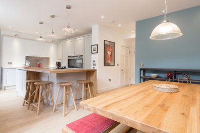 Photo of a classic open plan kitchen in Edinburgh with grey cabinets and an island.